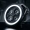 Clear lens front vehicle headlight housing assembly unit on a black background